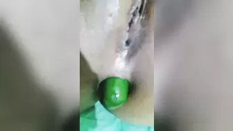 Sleazy Muslim hijab lady anal and vagina fucking with cucumber