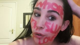 Skank full of degrading lipstick writing on her face humiliating herself as she talks kinky to the viewer