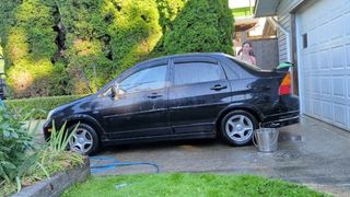 Cute t4t trans woman washes her filthy car for the hungering maw of capitalism with a huge glass plug