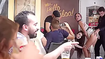 Two uninhibited brunette fucking with strangers in a café on the couch...